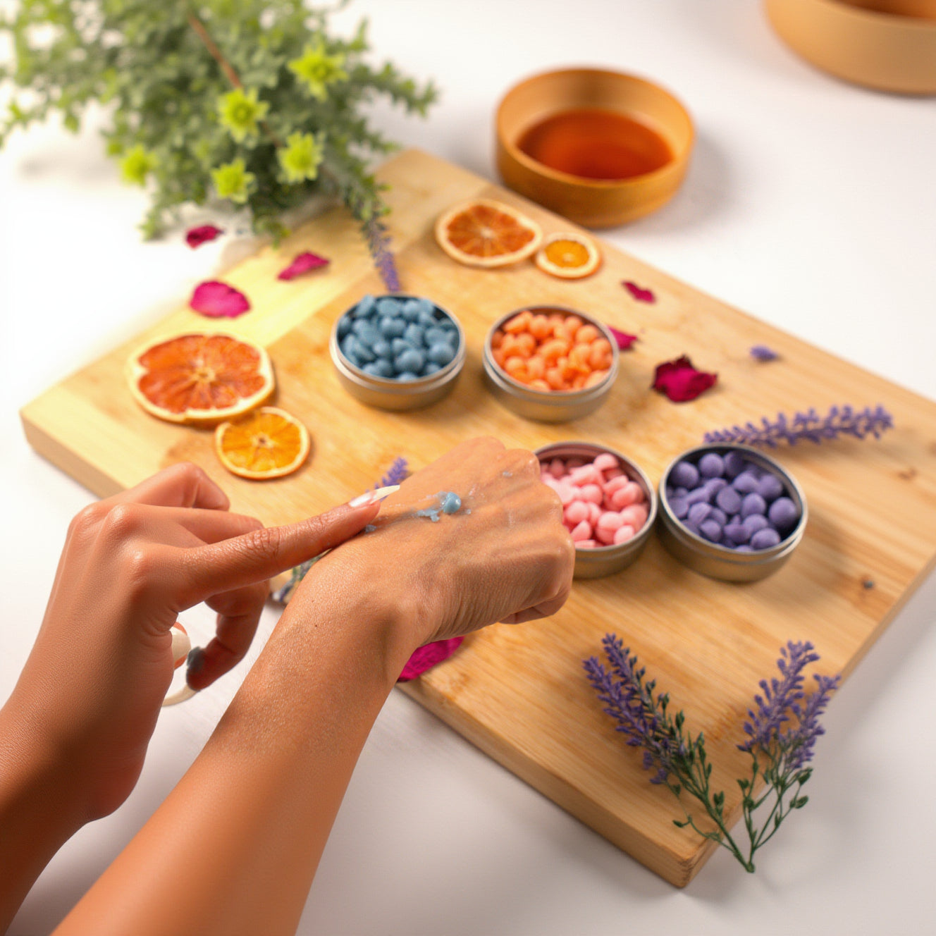 Colorful candy bowls on a wooden board with decorative elements